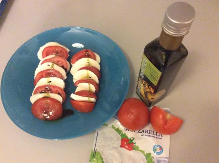 Mozzarella and tomatoes with pumpkin seed oil